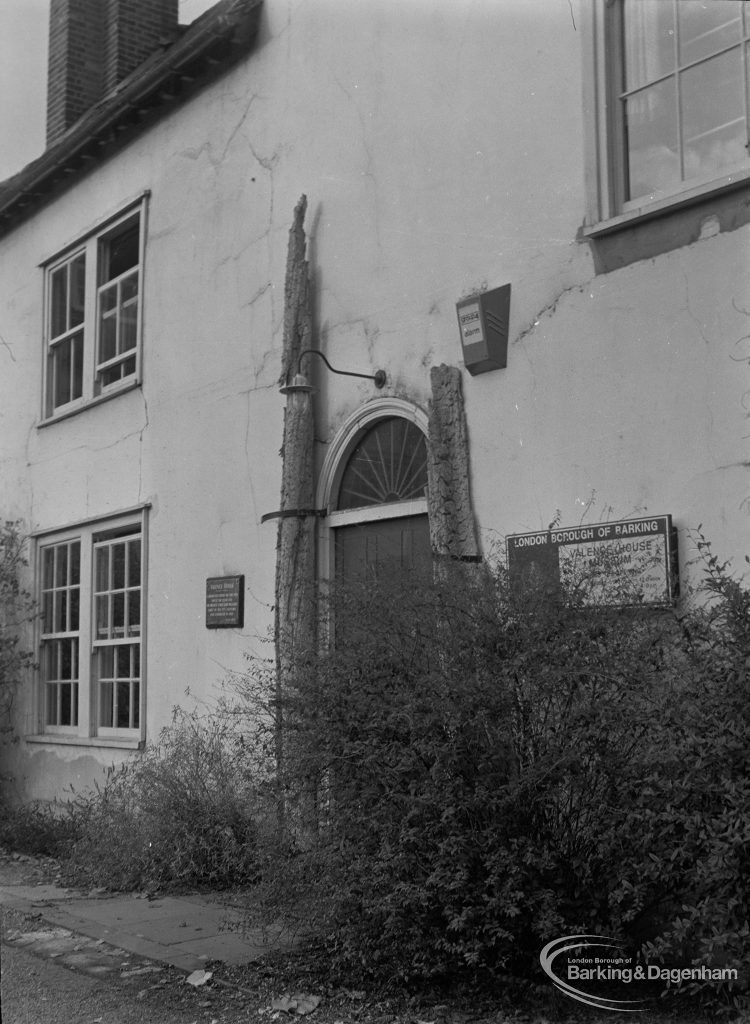 Valence House, Becontree Avenue, Dagenham in need of exterior repair, showing front doorway from east, overgrown and with cracked plaster, 1975