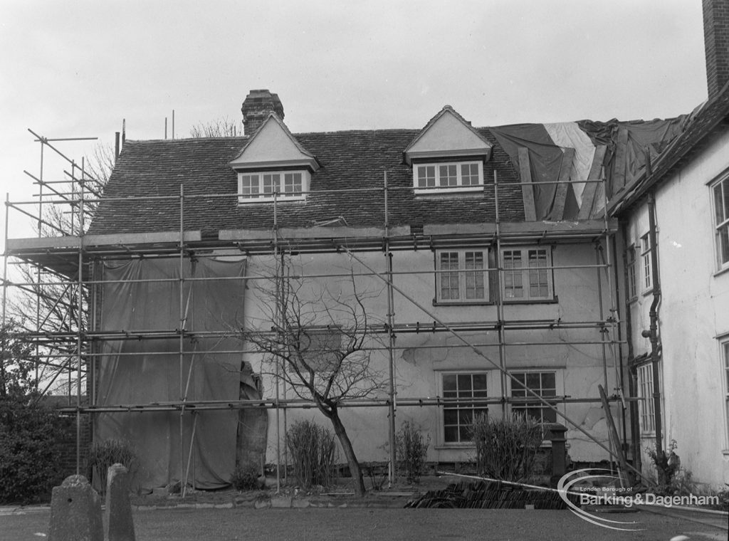 Valence House, Becontree Avenue, Dagenham in need of repair and renovation, showing general view of east wall, south wing, with roof, tarpaulin and scaffolding, 1977