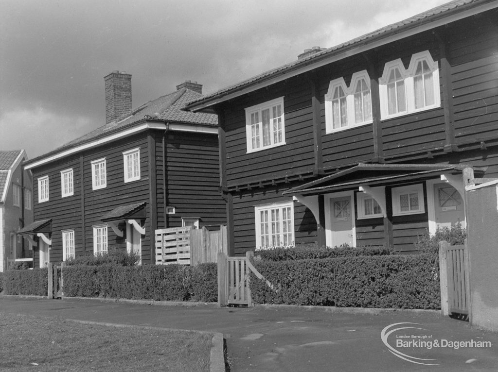 Timber housing in Wood Lane, Dagenham, showing 251 Wood Lane, looking north along green, 1977