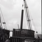 Dagenham Council Sewage banks reconstruction, showing crane lowering pipe, 1965