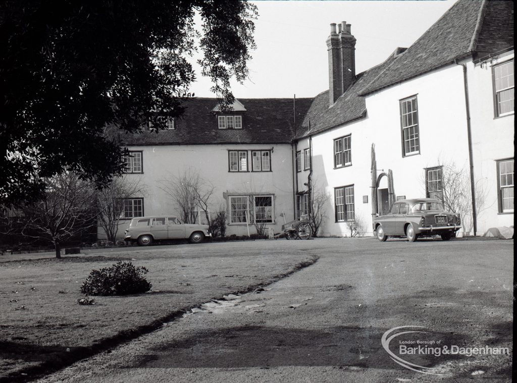 Valence House, Dagenham during the dredging of the Moat, showing exterior of Valence House and a Singer Gazelle car, taken from south-east, 1965