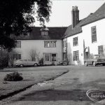 Valence House, Dagenham during the dredging of the Moat, showing exterior of Valence House and a Singer Gazelle car, taken from south-east, 1965