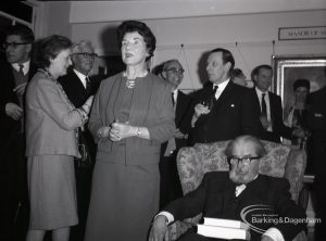 Chairman of Dagenham Council Libraries Committee Alderman Mrs A R Thomas and other guests talking on the occasion of the retirement of Borough Librarian John Gerald O’Leary, 1965