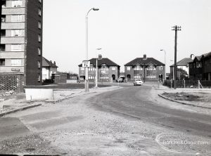 Road construction in Rainham Road South, Dagenham, showing completed portion with Madrid Court tower block and houses,1965