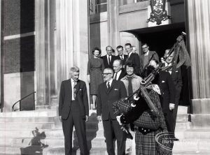 Reception for Dagenham Borough Surveyor and Engineer Mr Jack Jones, showing group of staff on steps of Civic Centre with Dagenham Girl Pipers, 1965