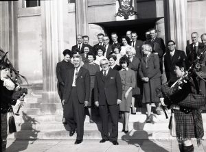 Reception for Dagenham Borough Surveyor and Engineer Mr Jack Jones, showing group of staff on steps of Civic Centre with Dagenham Girl Pipers, taken from west, 1965