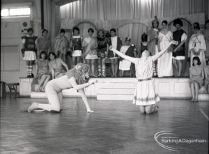 Dagenham Secondary school play, with children performing Androcles and the Lion, showing Androcles with upraised arms, Lion, and cast, 1965