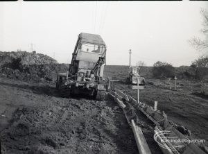 Dagenham Sewage Works Reconstruction IV, showing bulldozing by spoil heaps,1965