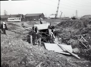 Dagenham Sewage Works Reconstruction IV, showing men at work in the trench,1965