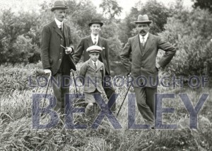 PHBOS_2_1360 Group of men, and a boy standing in field c1920