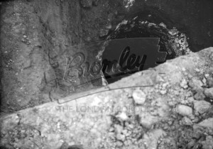 Excavation showing relics or vessels,  undated