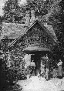 Victorian cottage and three people,