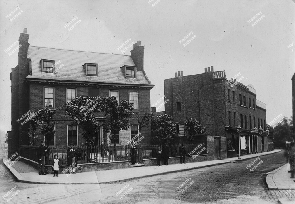 Homerton High street, north side, looking east from Isabella Road; showing the Peacock pub and Eagle House, c.1884.