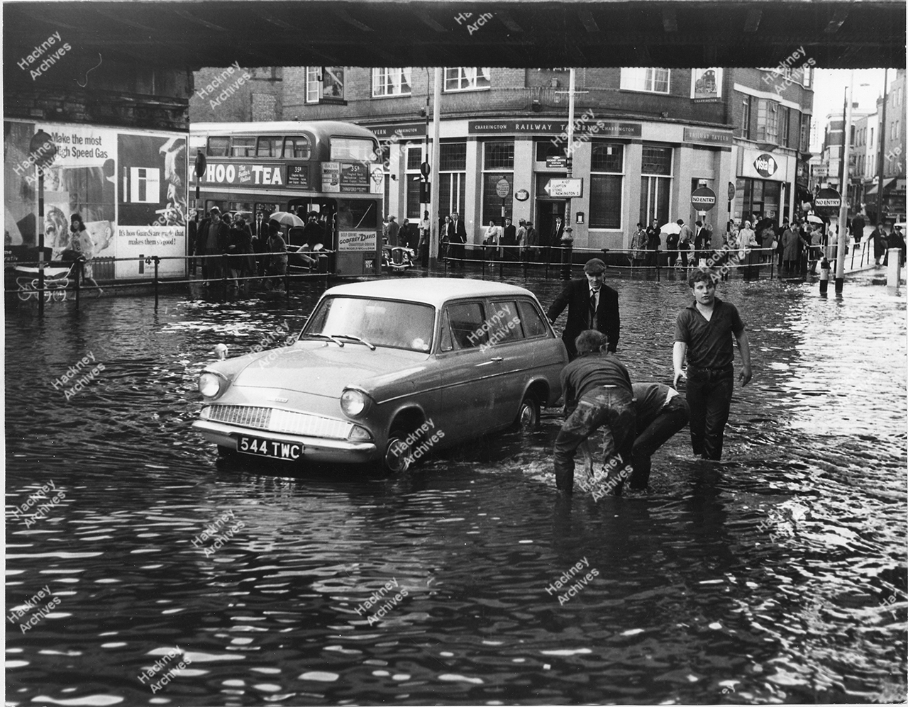 Flooding at Mare Street, Hackney. 1966. Underneath railway bridge on
