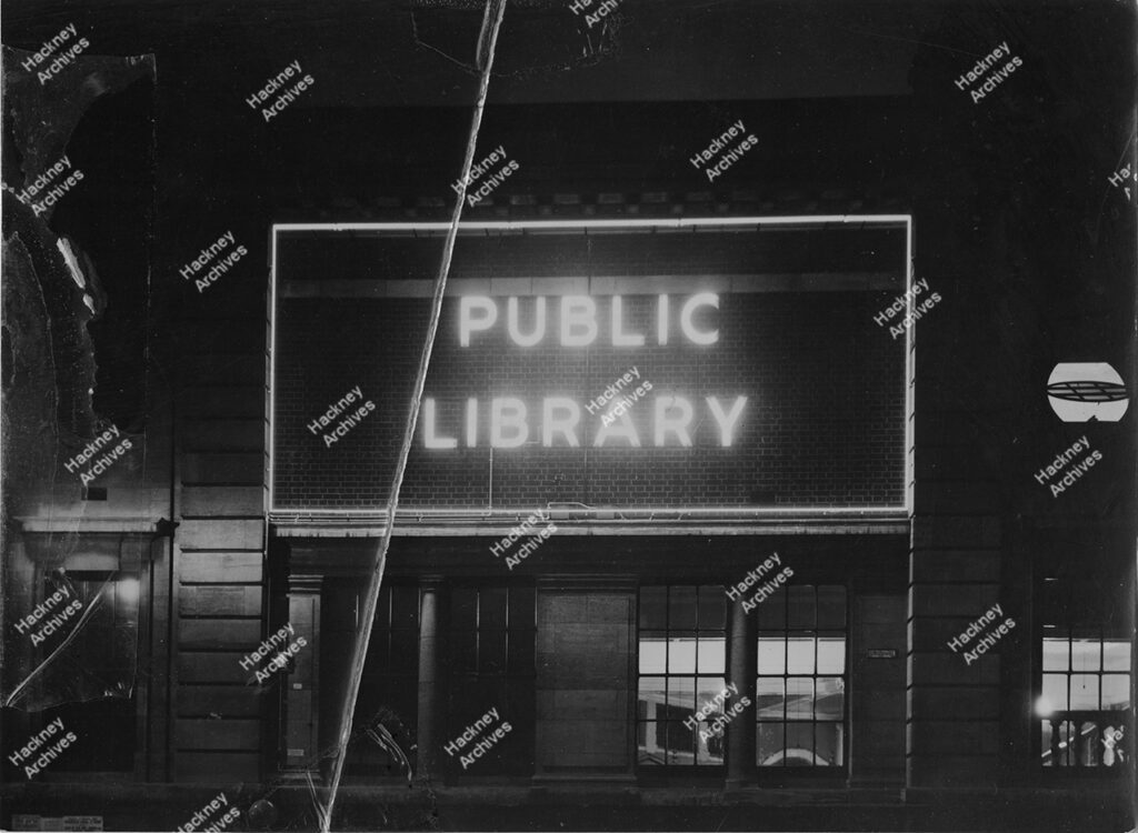 Hackney Central Library. Switching on Neon Sign and the sign from first storey level, 1935.