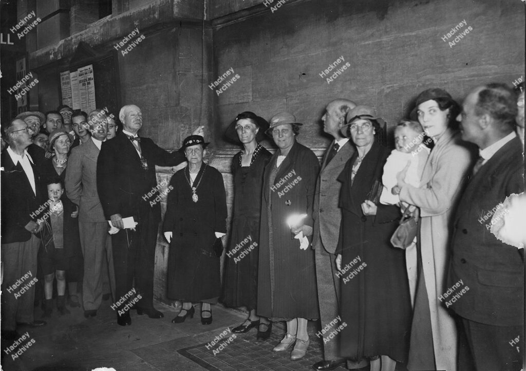 Hackney Central Library. Switching on Neon Sign and the sign from first storey level, 1935.
