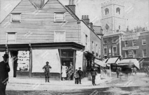 View looking north from junction of Mare Street and Amhurst Road, showing Hackney Tower and corner of Eight Bells pub, c.1868.