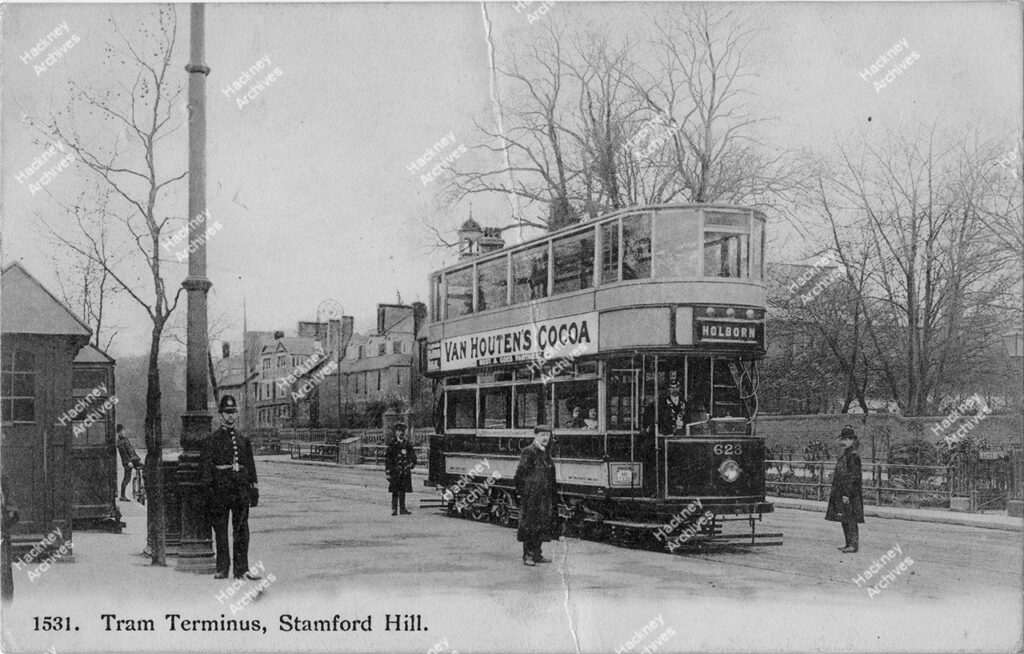 Tram Terminus, Stamford Hill, Hackney, c.1911. . Includes horse drawn tram and drivers, man on a tricycle, a hand cart and shops.