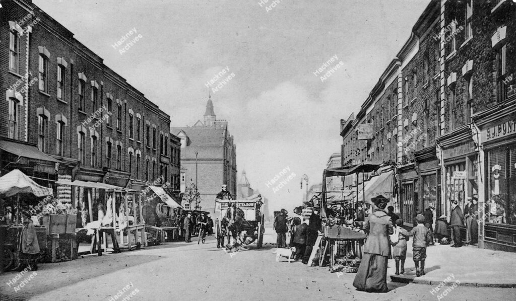 Chatsworth Road, looking north from junction with Blurton Road, showing Rushmore Primary School. Market stalls, c.1905