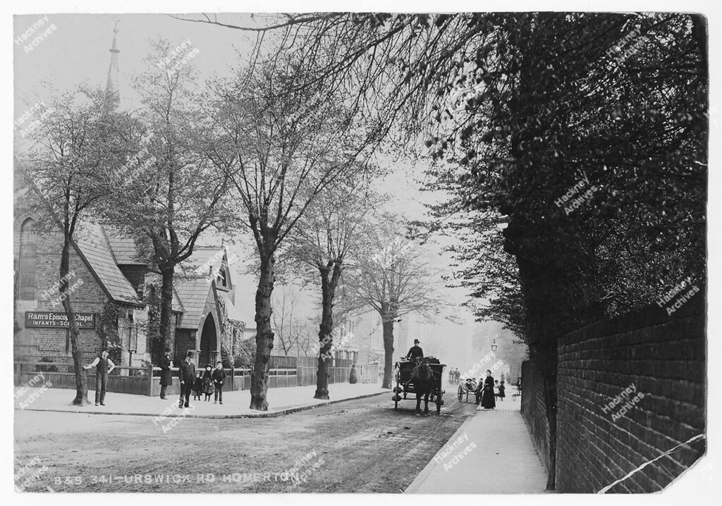 Urswick Road, looking south from junction with Tresham Avenue; showing Ram’s Episcopal Chapel Infants’ School, c.1880.