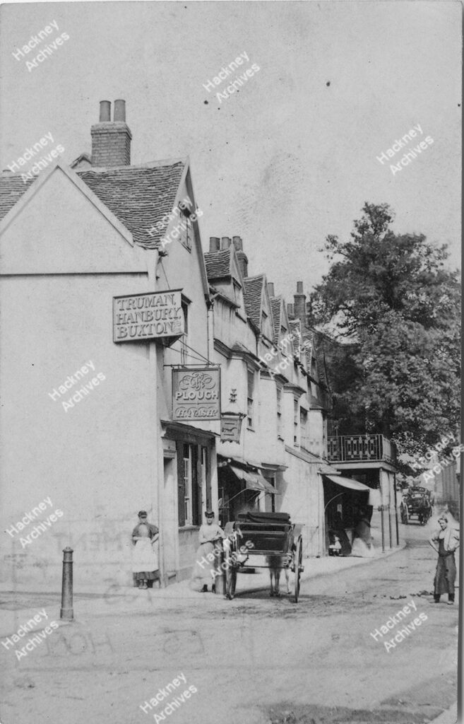 Homerton High Street looking east from junction with Plough Lane. Includes The Plough public house. Horse dawn carts, c.1870