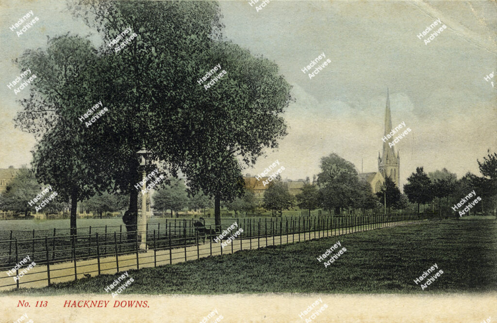 The path across Hackney Downs from the centre towards the south-east corner; showing Clapton Presbyterian Church, c.1910.