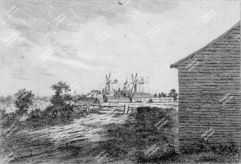 The White Lead Mills near Hoxton, Hackney, c.1800.Includes fields, hay bale, windmills and St. Paul’s Cathedral in the background. Print from an engraving byJames Peller Malcolm.