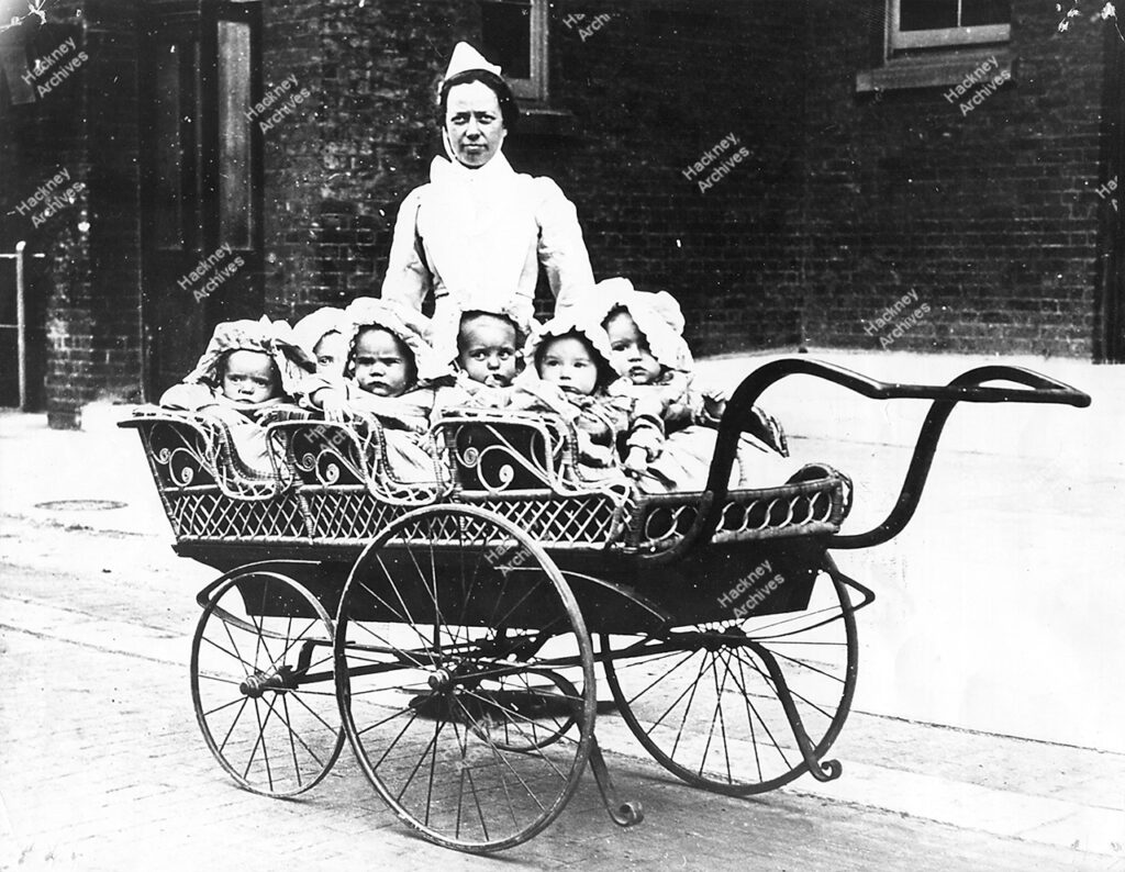 Hackney Workhouse, nurse and pram with babies, Hackney or Brentwood annexe, c.1900.