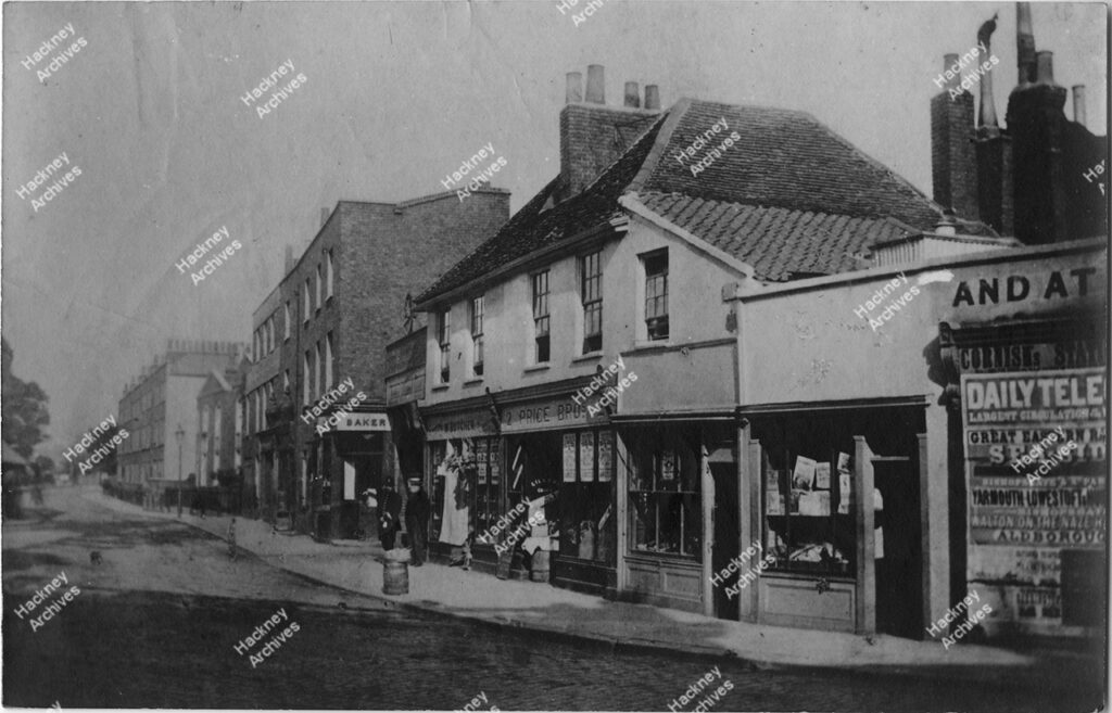 Well street, south east corner from Mare Street. Includes Price Bros grocer, Baynton J. music seller, Hurst C. P. Baker, c.1892.