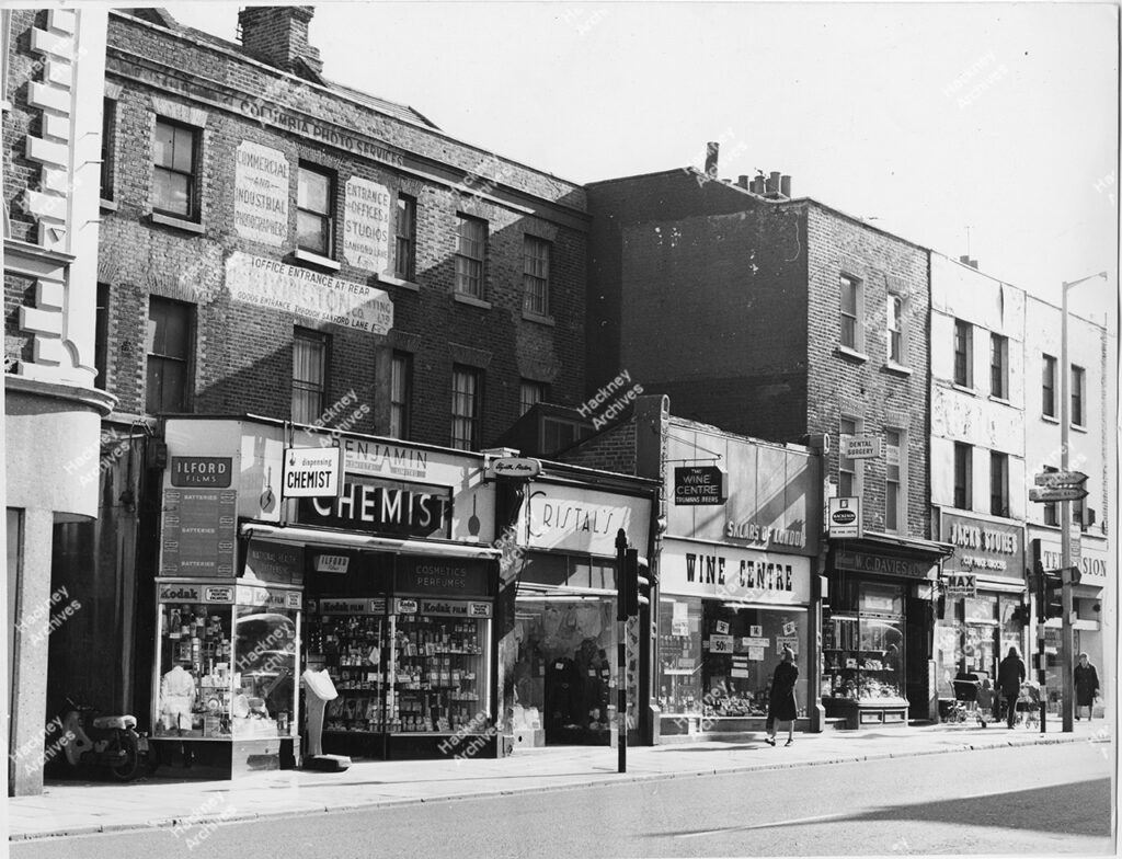 Stoke Newington High Street, east side, Hackney. 1870. Includes numbers 184-190, Benjamin Chemist, Crystal’s, Sklar’s of London wine centre, W, c. Davies & co, Jacks Stores, 1970.