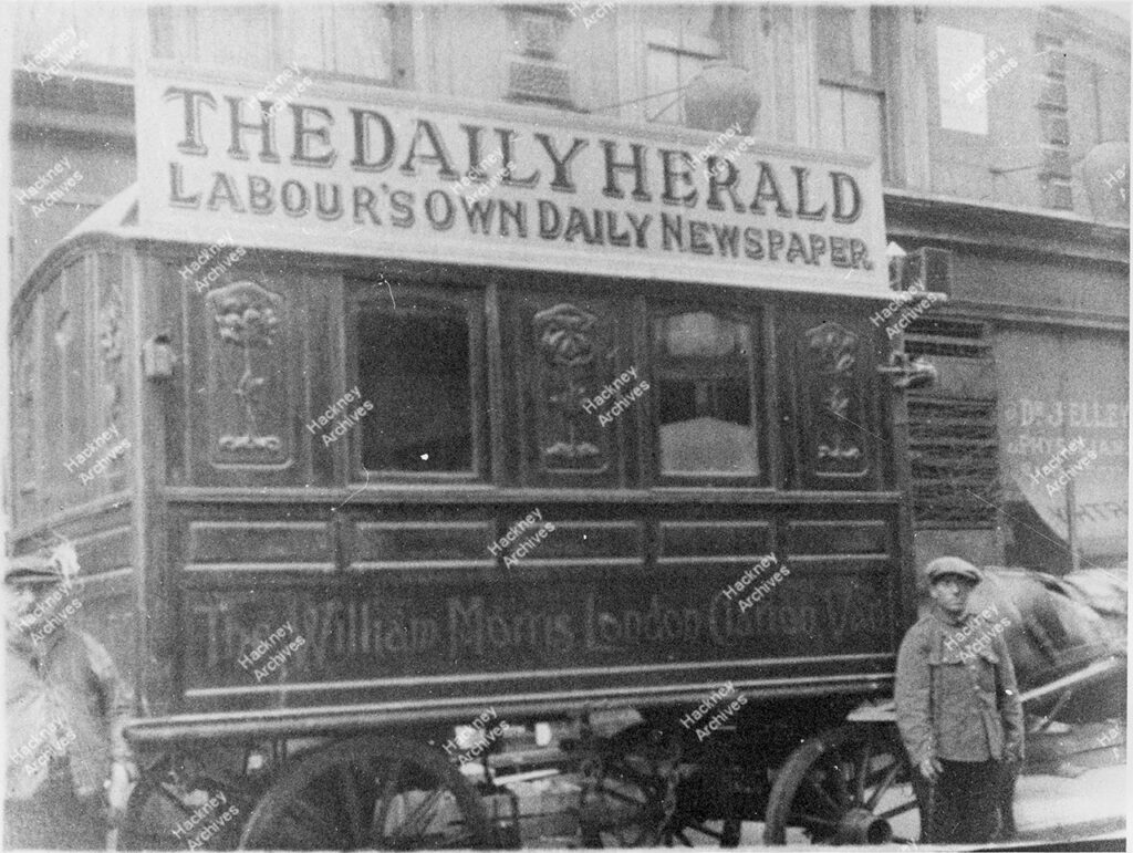 The William Morris Clarion Van at Homerton High Street, Homerton. Includes premised of Dr J. Elley, c.1923.