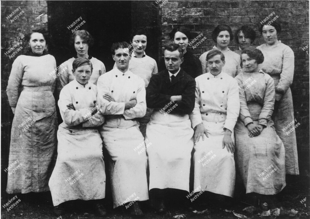 Spray’s Stores, Homerton High Street, Hackney, c.1905. Includes Mrs Yeulet, Ms. Kruger’s grandmother, adverts for chocolate and tea on shop windows.