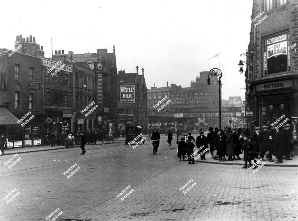 The Hackney Gazette, Kingsland Road, Hackney. 1953. Includes the art deco Odeon next door with Queen Elizabeth Coronation decoration adorning the building.