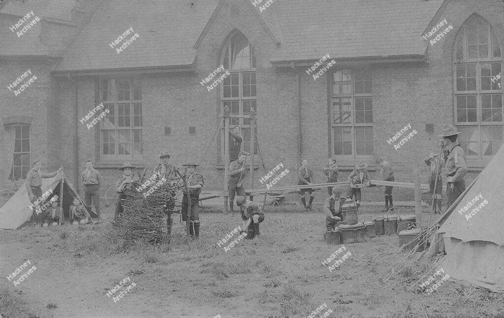 Boy Scouts from the 8th Hackney and 16th N.E. London troops c.1910. Group photograph and camp at St Augustine’s Church Hall, Victoria Park