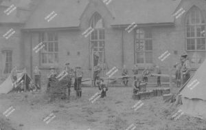 Boy Scouts from the 8th Hackney and 16th N.E. London troops c.1910. Group photograph and camp at St Augustine's Church Hall, Victoria Park
