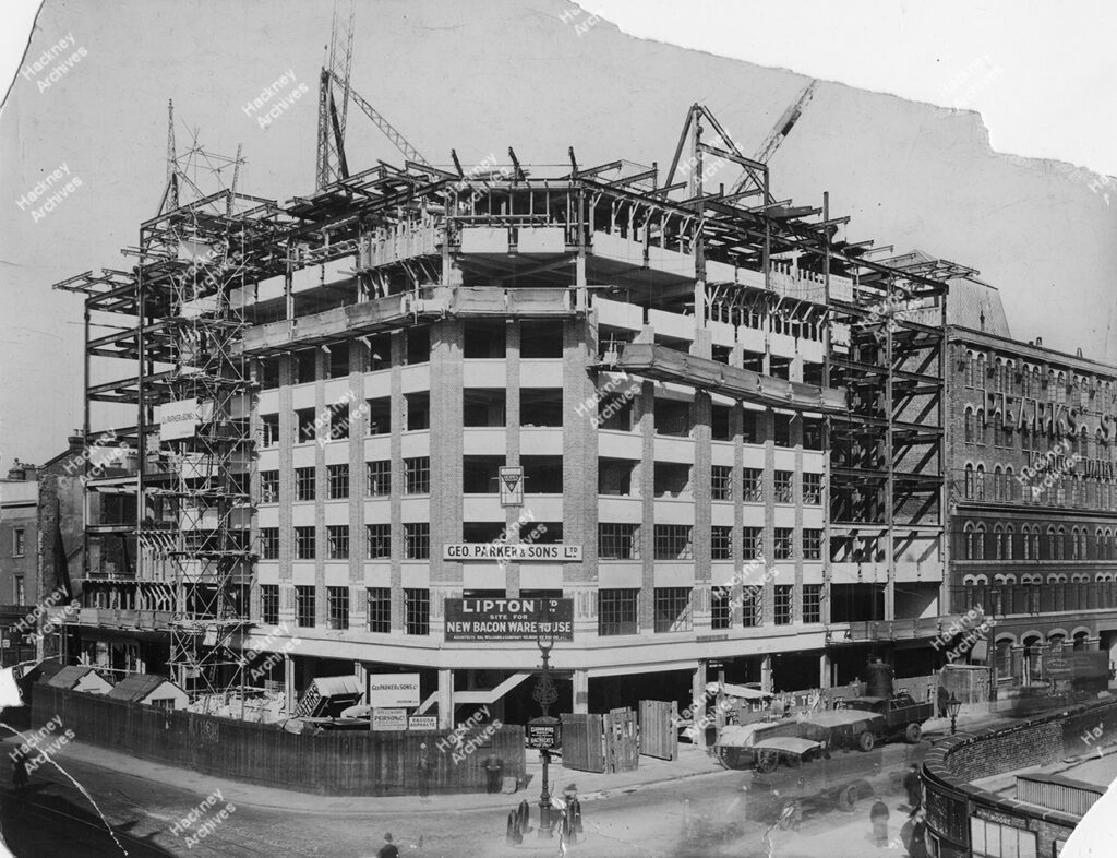 Liptons Tea, Bacon Warehouse, Shoreditch High Street, Shoreditch, Hackney.1933. Corner of Bethnal Green Road and Shoreditch High Street under construction by George Parker & Sons LTD.
