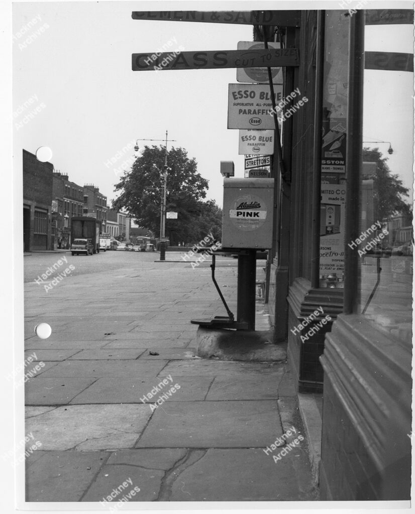 Adverts on shop front at Upper Clapton Road, Hackney, c.1962.