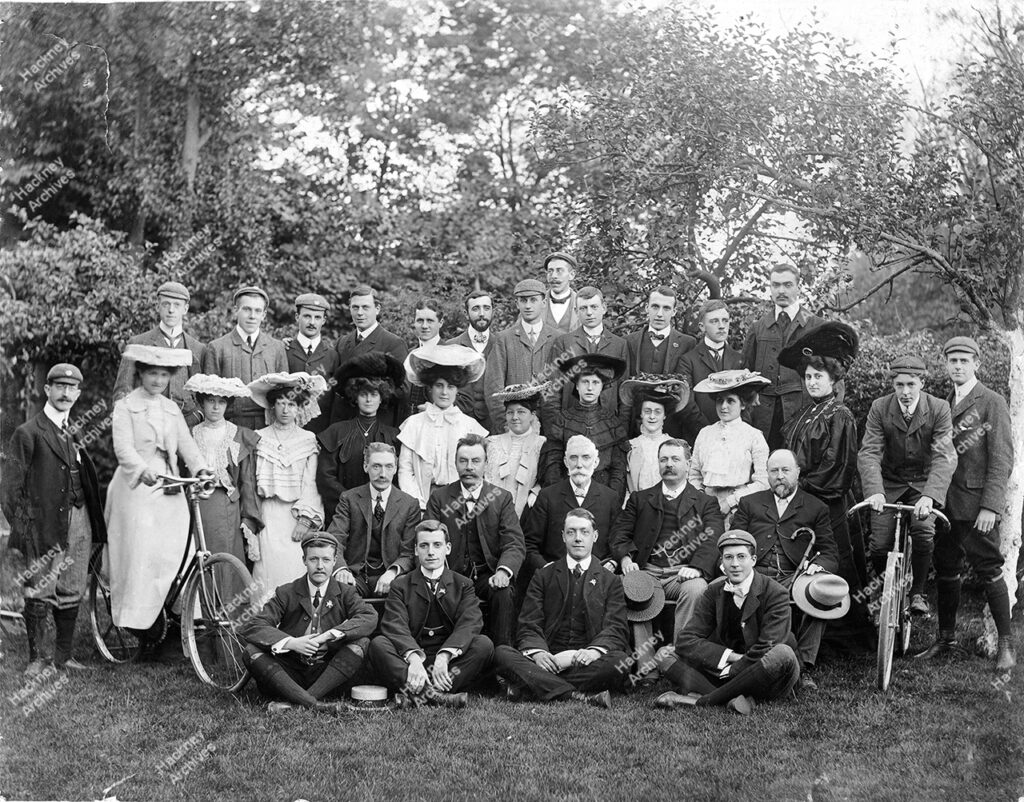 Stoke Newington Cycling Club. Posed group, possibly in open air, wood in background, 1895.