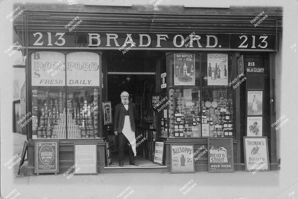 H. G. Bradford off licence, Lower Clapton Road,  Includes H. G. Bradford in the doorway of his shop. Hackney, c.1895.
