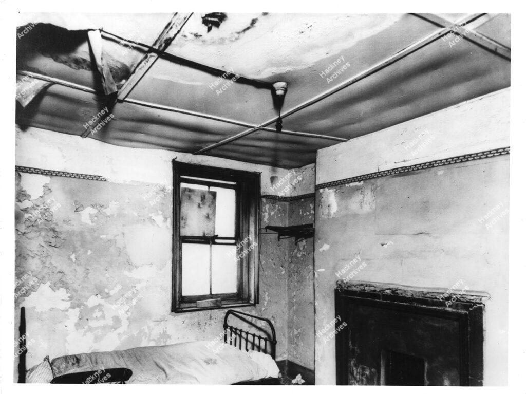 Example of the interior of a slum house bedroom, Shoreditch, Hackney, c.1950.