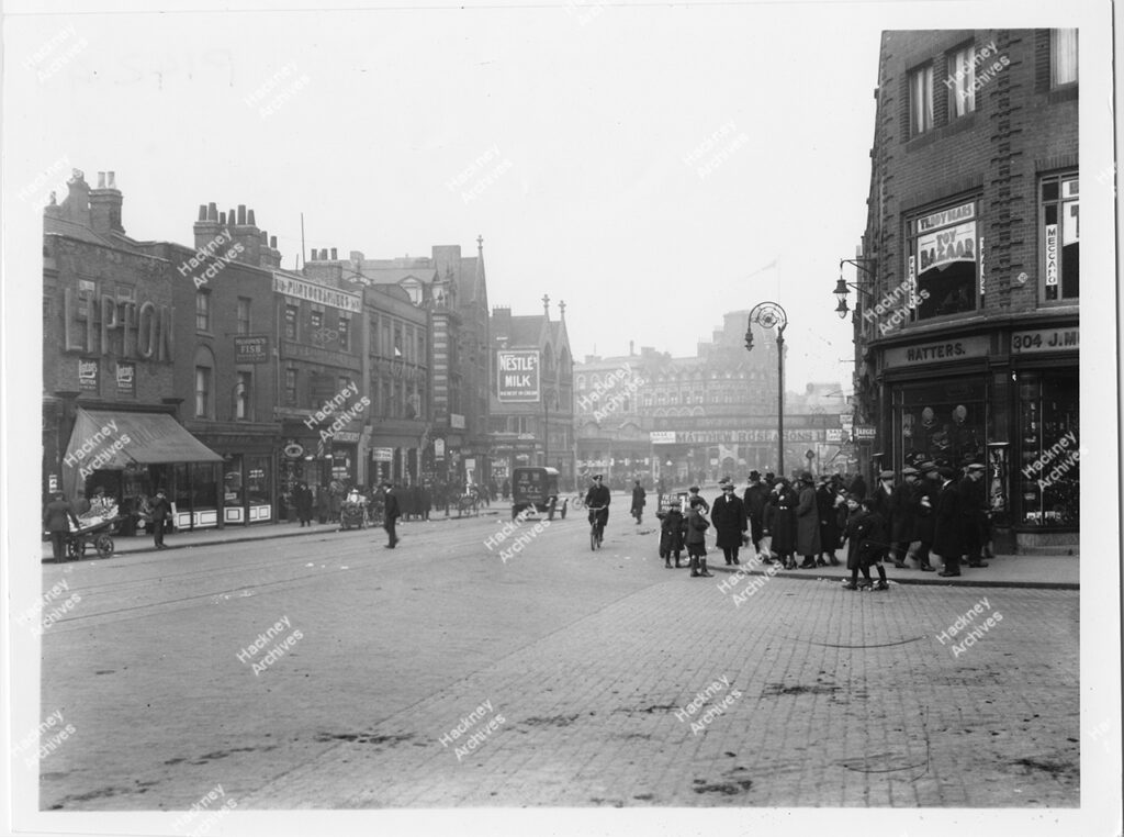 Mare Street with junction with Morning Lane  looking north towards London Railway Bridge, Hackney, c.1930.