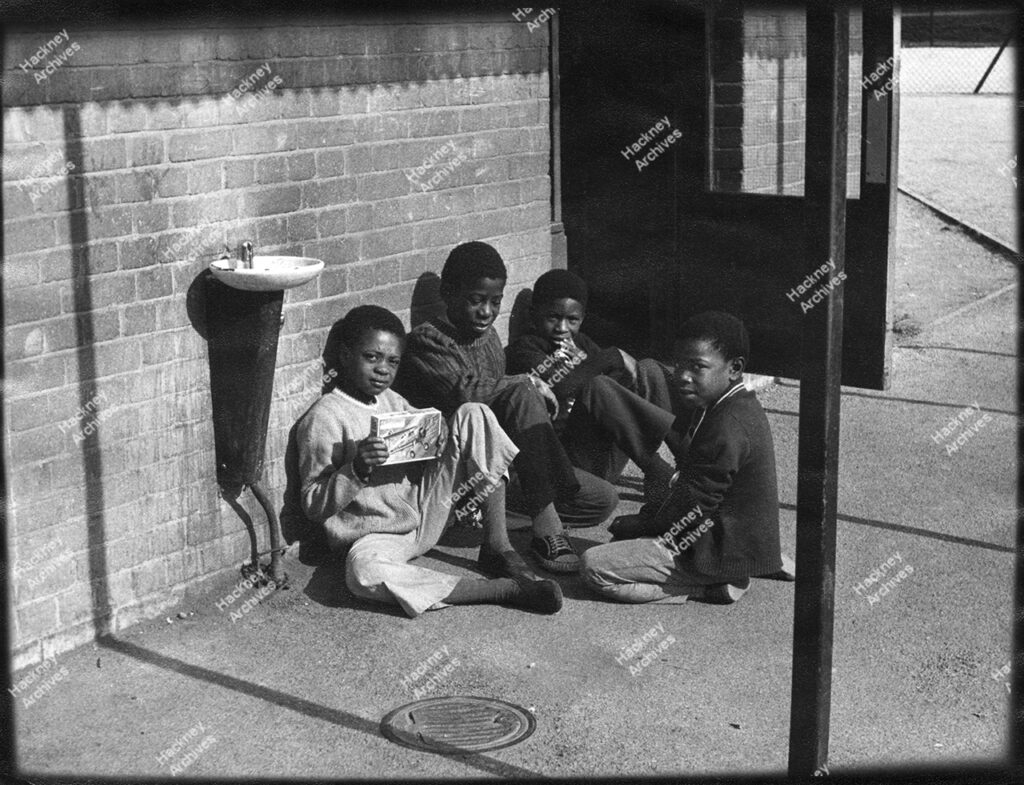 Group of Afro-Caribbean children in playground at Berger School, 1974.