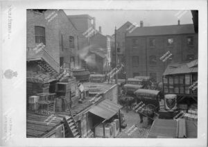 Clarke Nickolls and Coombs Confectionary makers. Views of the works on the west side of the Hackney cut, showing the GER bridge, wharf with barge, one of the yards (north) and a displayroom with product and advertising material, 1896-98.