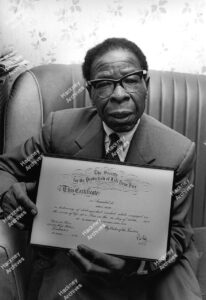 John A. Walter, Brighton Road.  Holding his certificate for rescuing 2 children from a fire in his street, 1968.