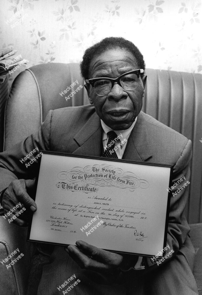 John A. Walter, Brighton Road.  Holding his certificate for rescuing 2 children from a fire in his street, 1968.
