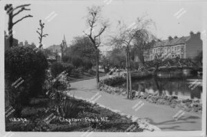 Postcard of Clapton Pond. Includes Lower Clapton Road, ponds, bridge and St. James's Church., Hackney, c.1928.