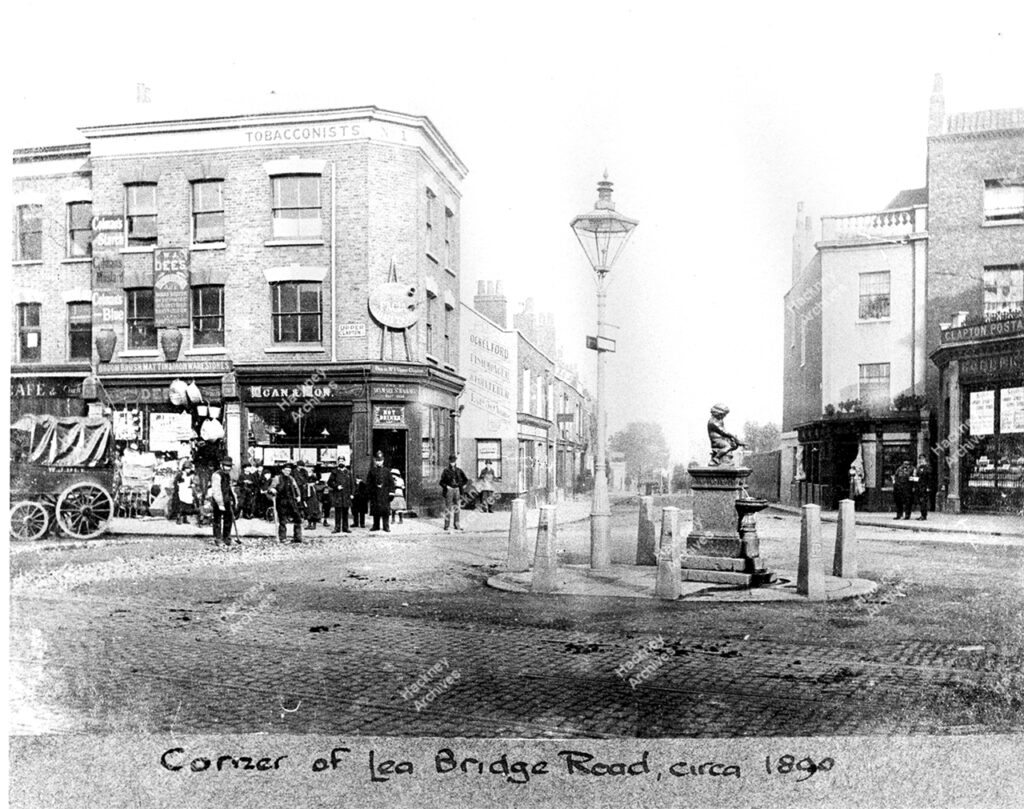 Entrance to Lea Bridge Road, with part of Upper Clapton Road; showing drinking fountain in middle of road, 1892