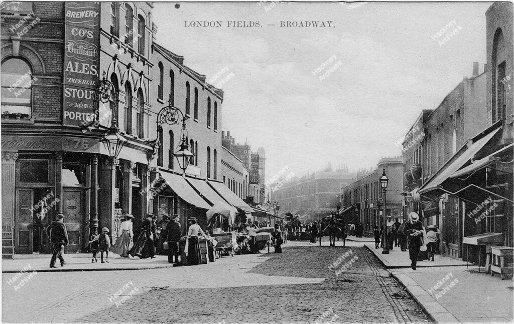 Looking south along Broadway Market from westgate Street junction; showing the Cat and Mutton and Lord Duncan pubs, with Dericote Street turning on the right, c.1890.