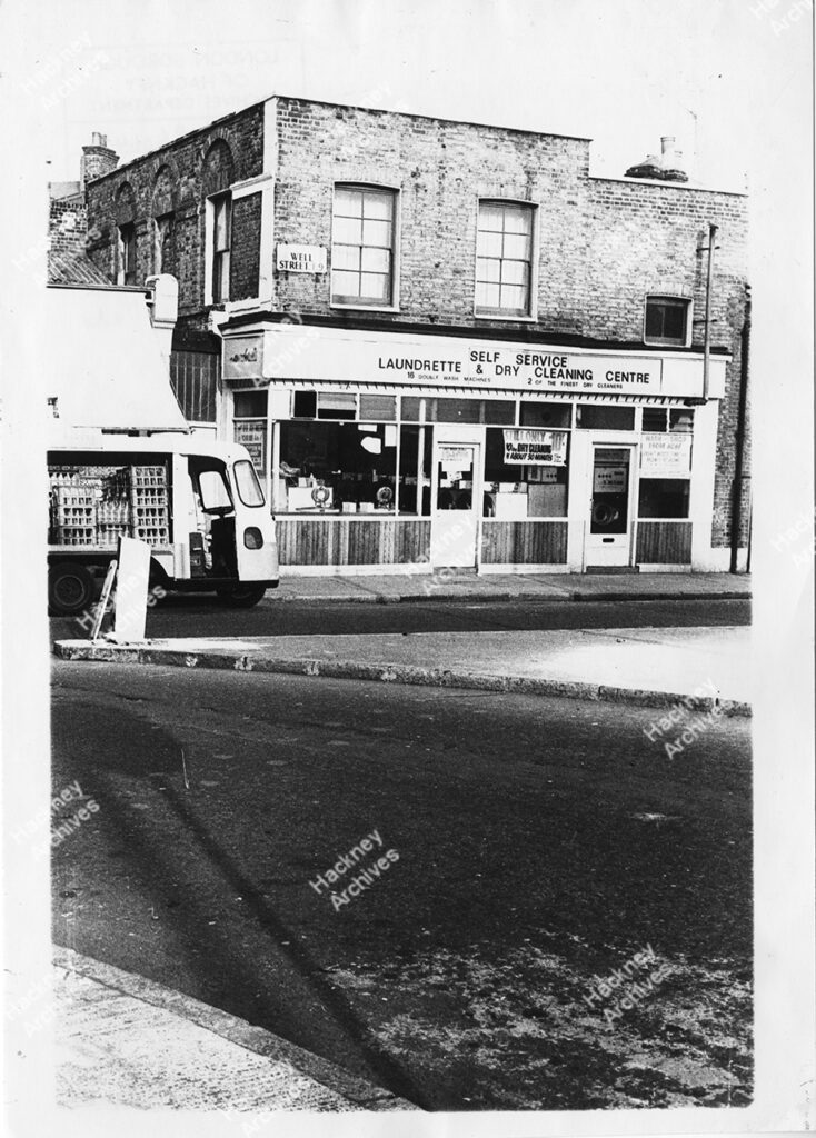 Laundrette and Dry Cleaning Centre, Well Street and corner of Morning Lane, Hackney. Includes Milk float, 1974.