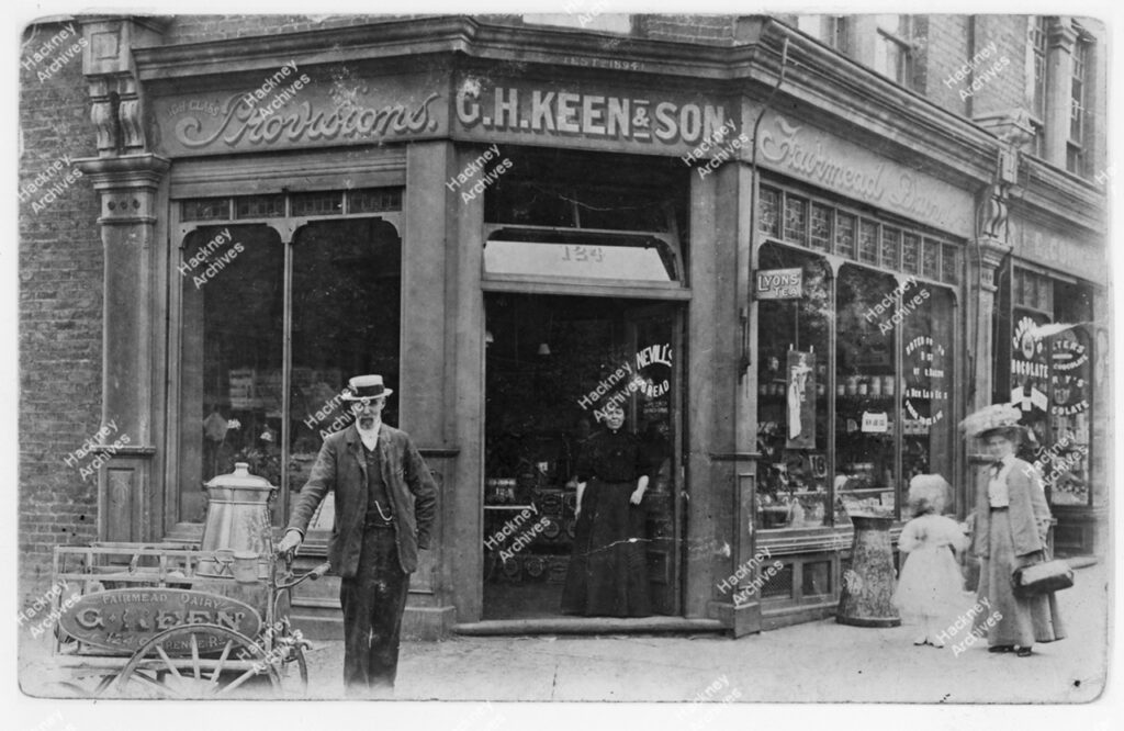 G. H. Keen & Son, Fairmead dairy and grocers, Clarence Road, Hackney. Includes dairy barrow and shop proprietors, c.1905.